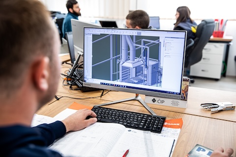 Engineer working on design of sandblasting furcance