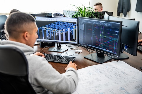 Engineer working on steel contruction for a hall